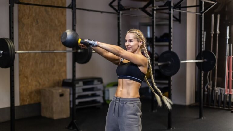 Woman performing a kettlebell swing