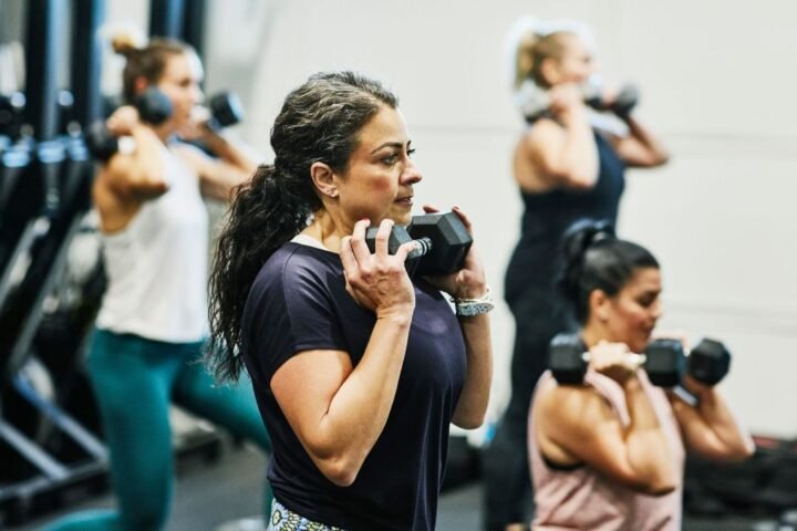 Woman doing strength training with dumbbell