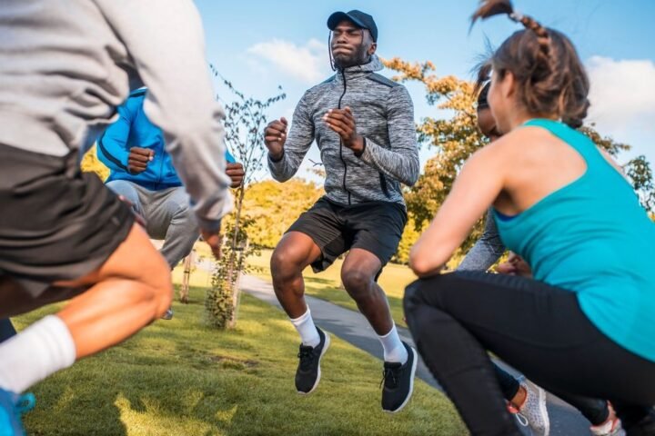 Group of people jumping as part of workout