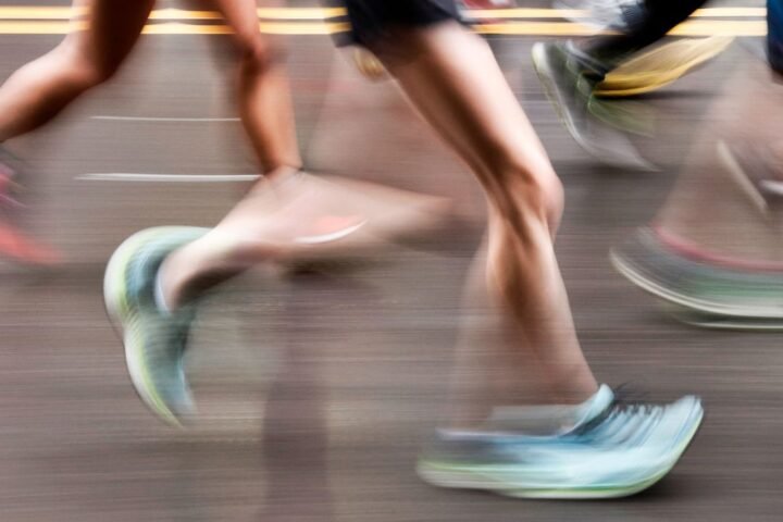 Feet of runners, photographed with motion blur