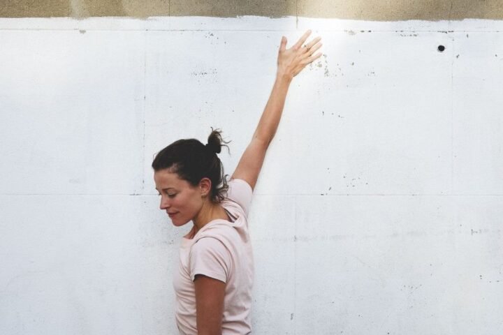 Naomi Annand demonstrating the clock shoulder stretch