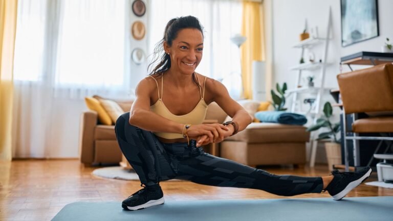 Woman performing Cossack squat at home