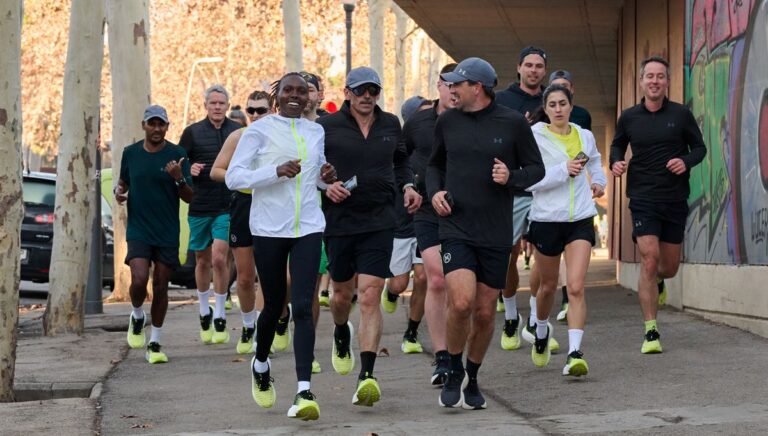 Sharon Lokedi running with a pack of journalists