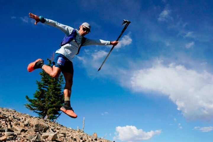 An athlete poses for a picture as he descends from the Hidden Peak aid station in the UTMB World Series: 50K Speedgoat Mountain Race on July 23, 2022 in Snowbird, Utah