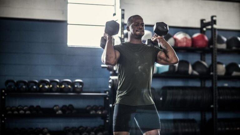 A man completing a CrossFit workout with dumbbells